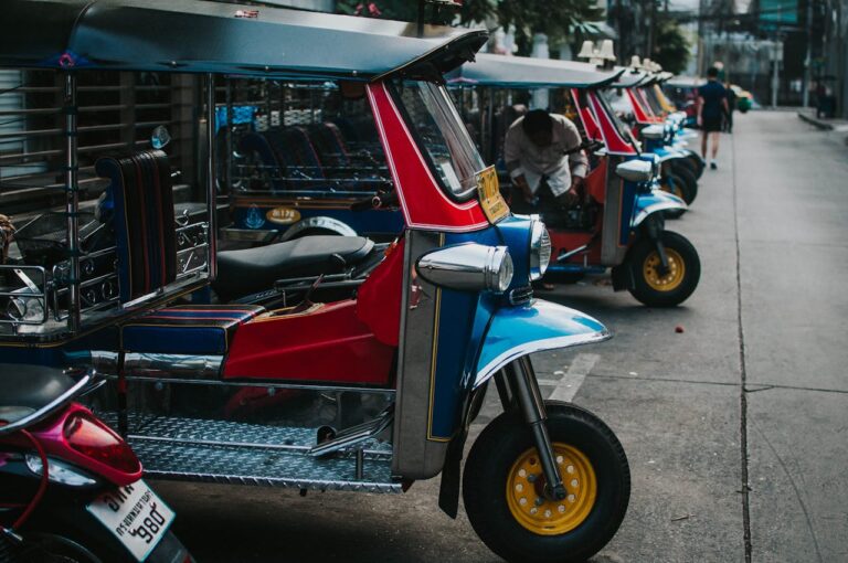 Thainland travel Tuk Tuk Auto Rickshaw Parked on Pavement